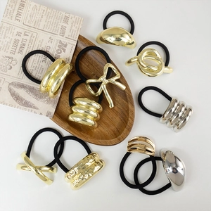 Chic metallic geometric hair ties in gold and silver finish with black elastic bands