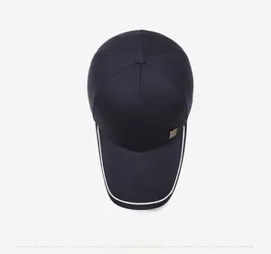 Top view of baseball cap showing gold metal logo and white contrast line detailing