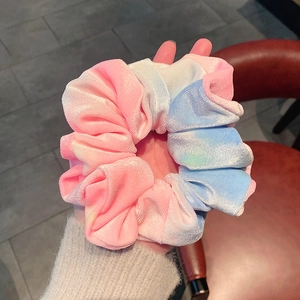 Pink and blue gradient velvet hair scrunchie with soft tie-dye texture for women