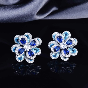 Elegant silver flower earrings with blue and light blue zircon crystals on silk