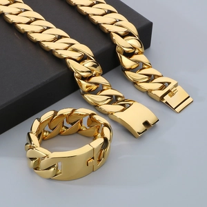 Macro shot of 31mm heavy gold Cuban link chain set including necklace and bracelet