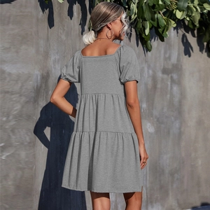 Back view of a grey short sleeve tiered knit dress with a square neckline for women