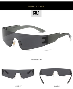 Macro detail of rimless wraparound sports sunglasses with smoke grey lenses and sleek temples