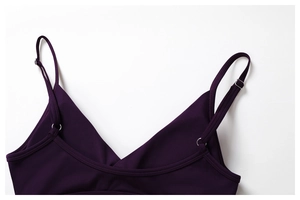 Macro shot of adjustable slim straps and V-neckline on this deep purple yoga sports bra