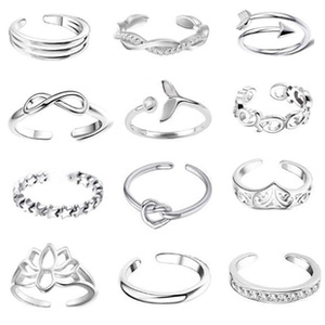 Macro detail of 12-piece adjustable silver rings set with diverse minimalist designs