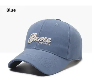 Detail of the high-quality white letter embroidery on the blue cotton baseball cap