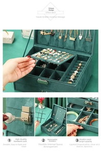 Detail view of double-layer emerald velvet jewelry box with secure metal lock and key