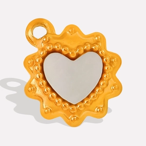 Detail of 304 stainless steel heart pendant with gold beaded edge and silver center
