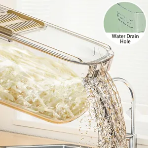 Multifunctional vegetable slicer with transparent drainage container and water outlet
