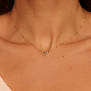 18K gold plated stainless steel necklace with blue and white zircon stones on a model