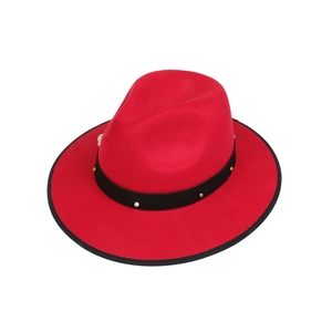 Detail of red fedora hat with black band featuring pearls and metal stud embellishments