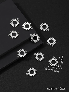Macro detail of 10pcs silver sunburst rhinestone pendants with dimensions 1.6x2.0cm