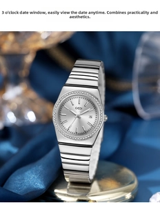 Detailed shot of GEDI silver watch dial with rhinestone bezel and calendar display