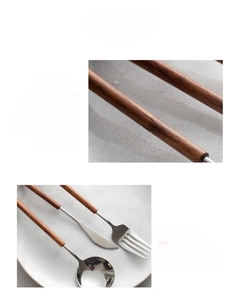 Close-up of 304 stainless steel cutlery set with natural pear wood handles on a plate