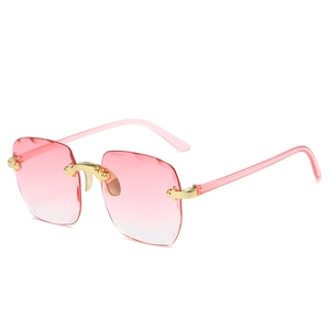 Fashionable rimless square sunglasses with pink gradient lenses and gold metal temples
