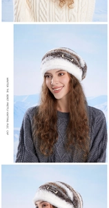 Detailed view of winter knit beanie showing faux fur texture and brand leather tag
