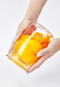 Close-up of airtight glass jar with metal buckle showing leakproof seal for food