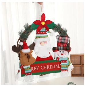 Detail of Christmas wreath featuring Santa, snowman, reindeer plushies and rattan ring