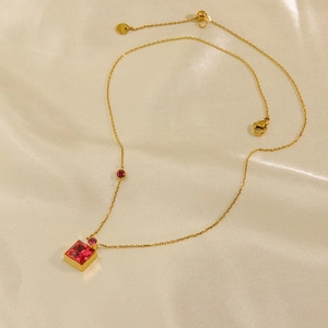 Elegant 14K gold plated stainless steel necklace with square pink crystal on silk