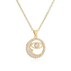 Close-up of gold moon and eye pendant with clear zircon crystals on O-chain