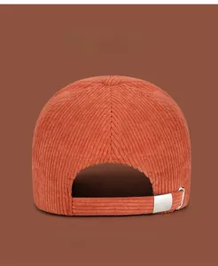 Rear view of corduroy baseball cap with adjustable metal buckle and striped texture