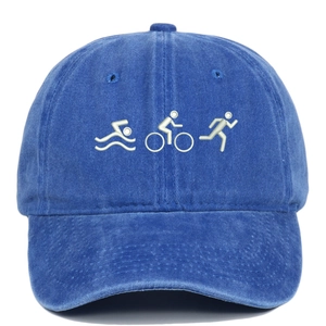 Close-up of triathlon embroidery on a washed blue vintage style baseball cap