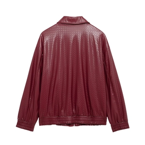Close-up of reddish brown woven faux leather texture on the back of bomber jacket