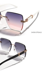 Detail of rimless diamond-cut sunglasses showing metal hinges and gradient lenses