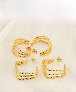 Detailed view of gold-plated twisted rope earrings in round and square geometric shapes