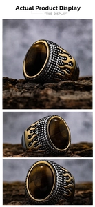 Macro shot of vintage tiger eye stone ring with golden flame relief and scaly texture