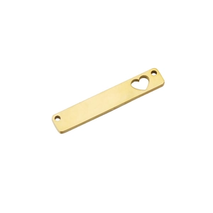Macro shot of gold stainless steel rectangular pendant with heart cutout for jewelry making