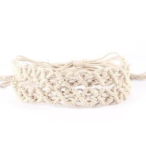 Macro view of handmade woven hemp rope accessories with vintage bull head decoration