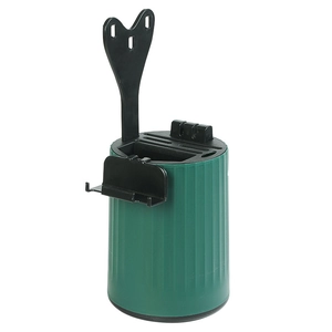 Rotating dark green kitchen knife block with built-in sharpener and wall-mount hanger
