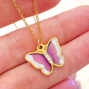 Golden butterfly pendant necklace with purple gradient wings and sparkling zircons