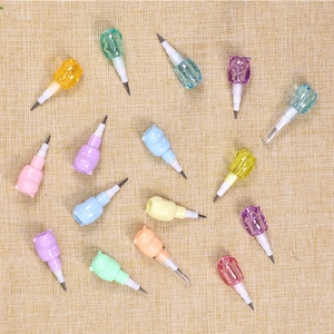 Close-up of colorful cartoon animal pencil extenders in transparent plastic caps