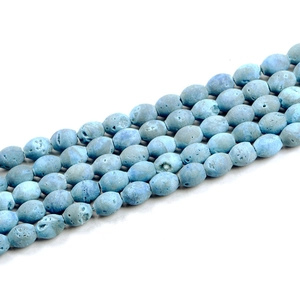Macro shot of light blue druzy agate beads with natural porous texture for DIY jewelry