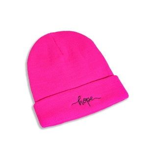 Detailed view of the rose pink knitted beanie featuring black hope script embroidery