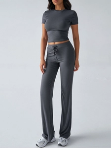Detailed view of women's dark grey short-sleeve T-shirt and drawstring casual pants
