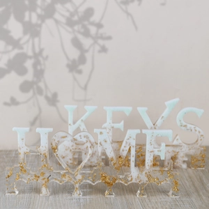 Details von HOME und KEYS Harz-Wandhaken mit Goldfolie und mintgrünem Farbverlauf