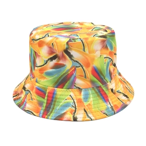 Close-up of tie-dye bucket hat with vibrant orange and green abstract floral print