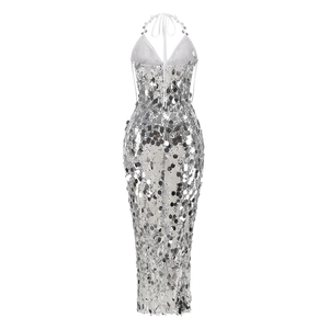 Close-up of silver sequin detail and halter neck design on backless evening dress