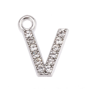 Close-up of letter V pendant with sparkling rhinestones on silver metal base