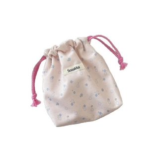 Floral drawstring storage bag in pink cotton canvas with blue flower pattern and logo