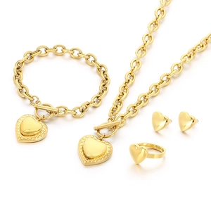 Gold stainless steel jewelry set featuring heart pendants and chunky chain links