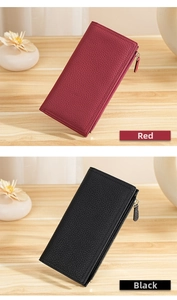Detail view of long leather wallets in red and black with litchi grain texture