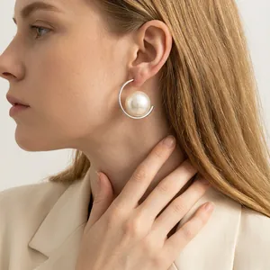 Elegant large white pearl C-shaped earrings with minimalist silver hoop for women