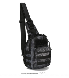 Detail of tactical camouflage chest bag with Molle system in Python Black color