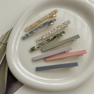 Set of 7 vintage French acetate hair clips with marble and shell patterns in assorted colors