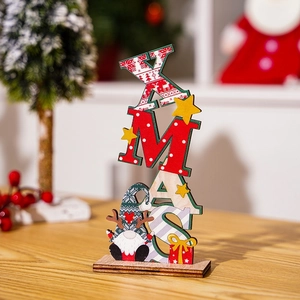 Close-up of wooden XMAS letter sign with painted Christmas gnomes and gift box detail