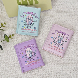 Three trifold wallets in blue, purple, and pink with rabbit girl illustrations and lace details
